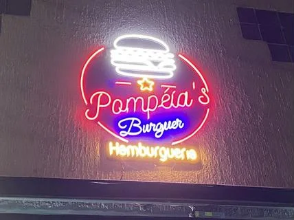 Letreiro em neon rosa e azul da Pompéia's Burger